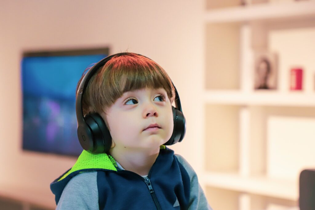 Little boy listening to headphones