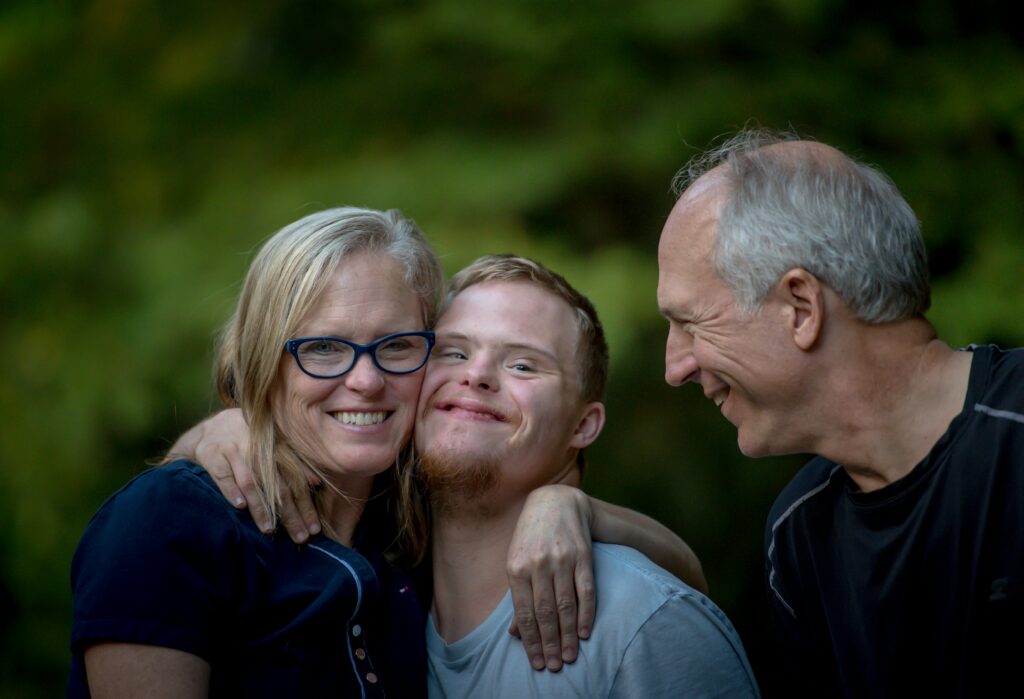 JMJ Disability news - family hugging